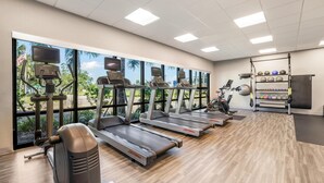 A gym with treadmills, exercise bikes, and a weightlifting area. - Hampton Inn Fort Myers Downtown (Fort Myers)