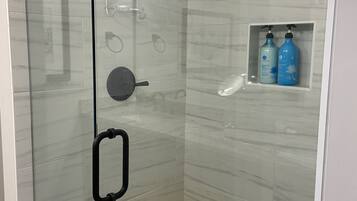 Shower, hair dryer, towels, soap