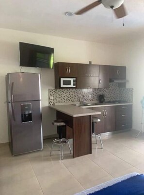 Fridge, microwave, stovetop, coffee/tea maker