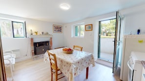 Enjoy a romantic dinner for two in this elegant dining area with a fireplace, surrounded by a beautiful view.