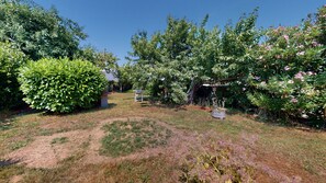 Stroll through this serene garden, surrounded by lush trees and vibrant plants.