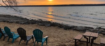 Lakefront luxury at its finest—two homes, a private beach, and spectacular Cayuga Lake views.