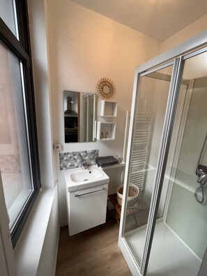 Shower, hair dryer, towels, soap