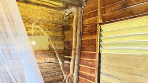 A rustic wooden interior with a ladder, a rope, and a white curtain. - Payag n' Kapitan, Experience Pinubre Living (Siquijor)