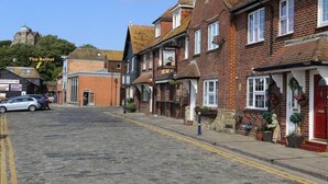 A traditional street with brick buildings, including a pub named "The Bethel."