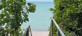 Lake Huron Getaway: Cozy Cottage, Private Access, Second-Row Location