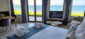 Deluxe Suite, Sea View | Premium bedding, down comforters, minibar, individually decorated