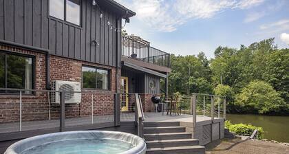 Chic Waterfront w/ Hot Tub, Sauna and Sky Deck!