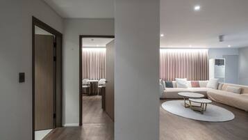 Presidential Suite | Living area | 65-inch flat-screen TV with cable channels