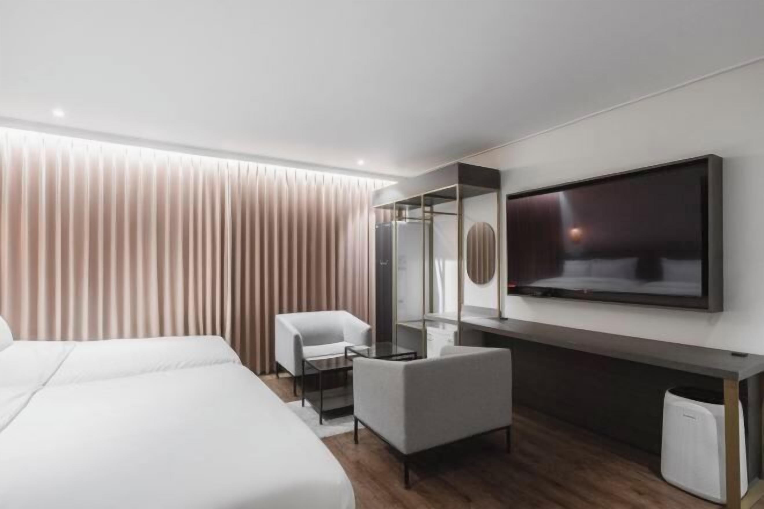 Down comforters, Select Comfort beds, blackout drapes, free WiFi