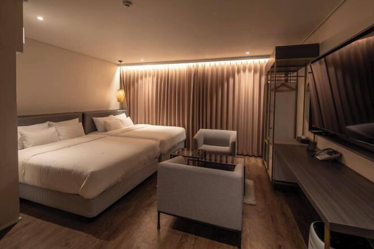 Down duvets, Select Comfort beds, blackout curtains, free WiFi