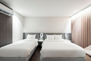 Deluxe Twin Room | Down comforters, Select Comfort beds, blackout drapes, free WiFi