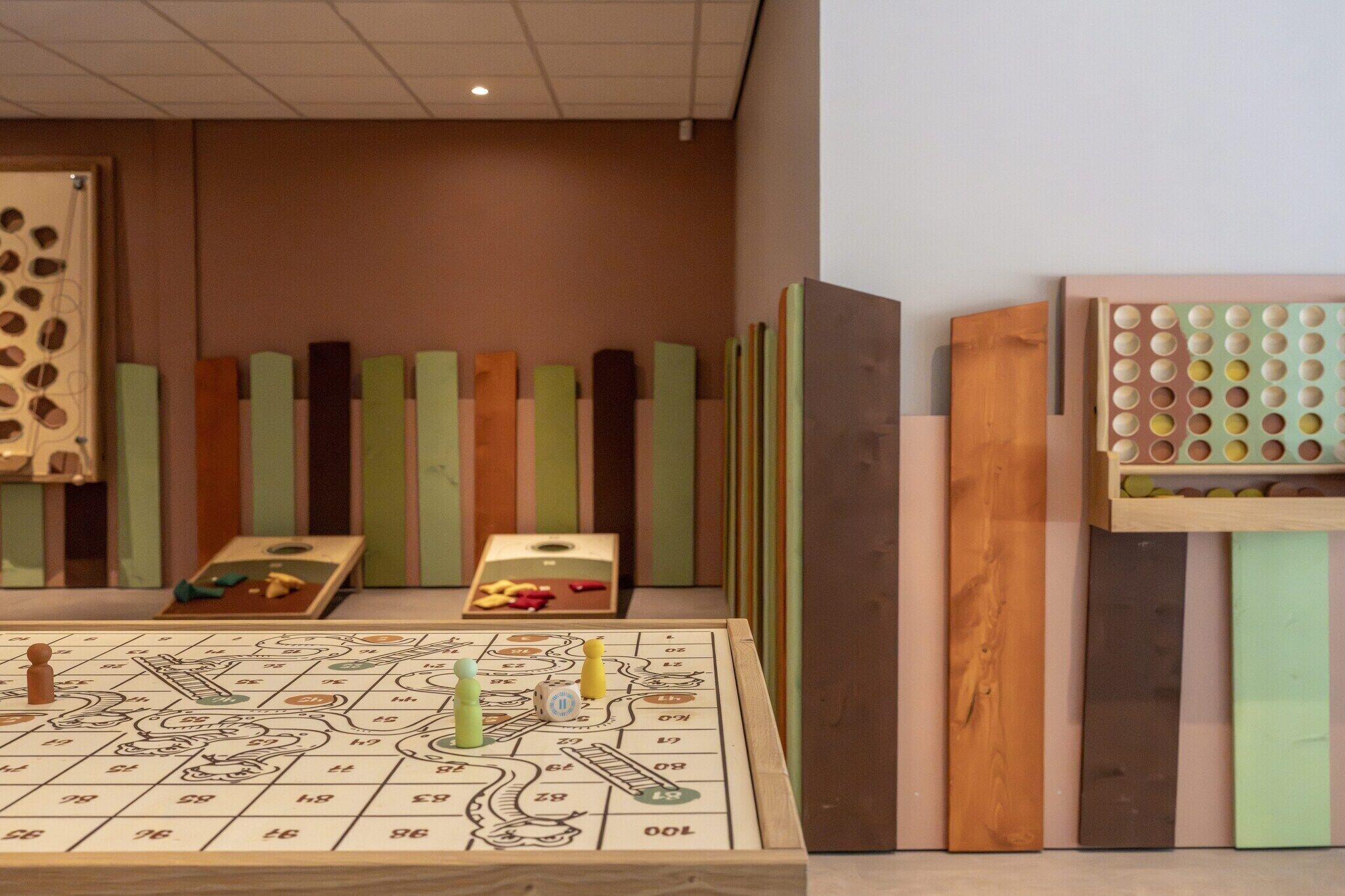 A board game setup with a game board, pieces, and dice.