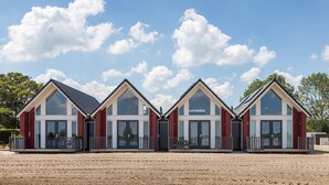 A row of identical buildings with large windows and a central entrance. - Vacation Stay Close to Tjeukermeer (Langelille)