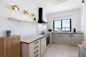 Fridge, microwave, oven, stovetop - Holiday Apartment 'Lindo T2 Com Vista Mar' with Wi-Fi & Air Conditioning (Quarteira)