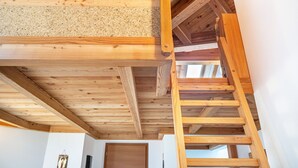 A wooden staircase with a handrail leading to a landing. - Holiday Apartment "Larch Soge Apt Paula" with Mountain View, Private Terrace & 2 Balconies (Racines)