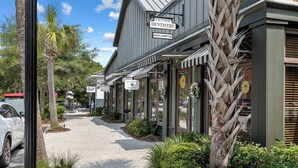 A street view with a building labeled "Village Dentistry" and a parked car. - Premier Golfside Getaway | Coastal Gallery (Kiawah Island)