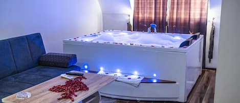 Honeymoon Penthouse | Living area | 90-inch LCD TV with satellite channels, heated floors