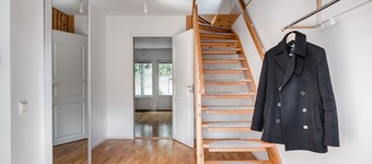 Large family home beside forest