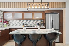 Fridge, microwave, stovetop, coffee/tea maker