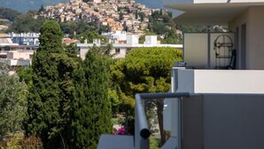 A view of a hillside town with buildings, trees, and a clear sky. - Rive de Cagnes by Interhome (Cagnes-sur-Mer)