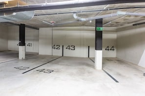 A parking garage with numbered parking spaces 41 to 44. - Han | Mountain view - pool - terrace (Estepona)