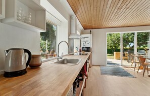 Fridge, stovetop, dishwasher, coffee/tea maker