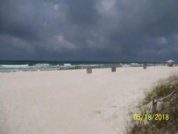 Enjoy a serene beach experience with a wide, open shoreline.