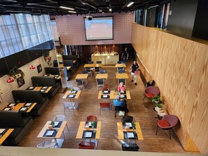 Enjoy dining in style with a mix of tables and booths, perfect for solo or group meals.