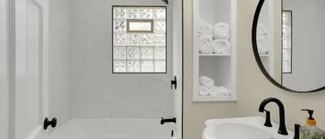 Shower, hair dryer, towels, soap