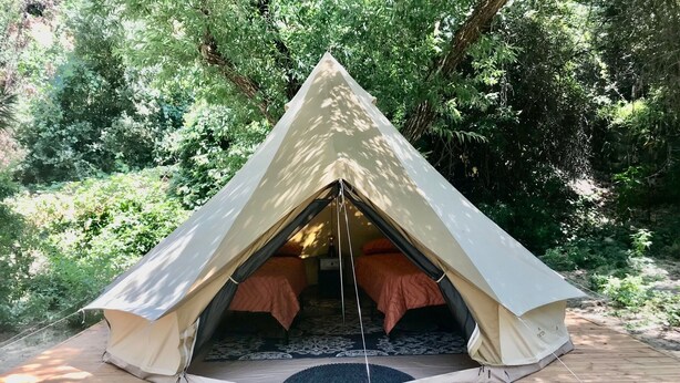 A tent set up on a wooden platform surrounded by greenery. - Sequoia Jewel -16 Foot Bell Tent with double beds. 4.5 to Sequoia National Park. (Three Rivers)