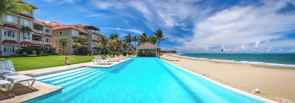 A resort with a swimming pool, beach, and ocean views. - Ocean Dream Cabarete (Cabarete)