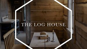 A log house interior with a wooden table, bench, and candle holder. - The Log House, Montana. Handmade & luxurious cabin. 10 min from Main St.  (Lewistown)
