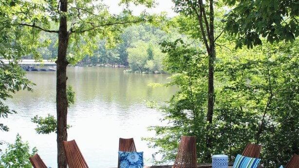 A lakeside seating area with fire pit and chairs. - Riverbend Ranch*Smith Lake Family Fun!*Dog Yard! (Crane Hill)