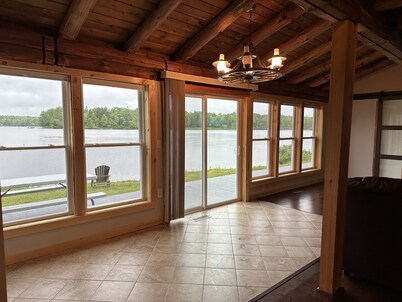 Beautiful private beach area within steps from the modern updated log home