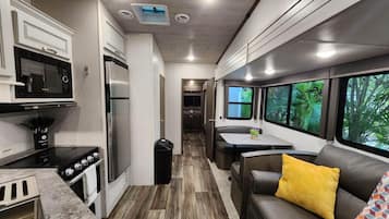 Fridge, microwave, stovetop, coffee/tea maker