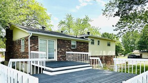 A single-story house with a front porch, a brick exterior, and a garage. - Sunshine Palace
Charming Tri-Level House with game room and large backyard! (West Chester)