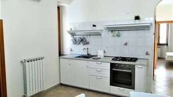 Fridge, oven, dining tables