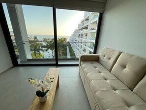 616 aria ocean | Living area | Flat-screen TV - Aria ocean nuevo vallarta  (Nuevo Nayarit)