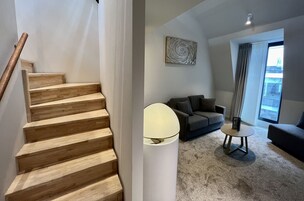 Deluxe Triple Room | Living area | 43-inch Smart TV with satellite channels, TV