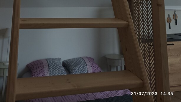 A wooden staircase leading to a lofted area with a skylight above. - Grand Studio 4 Couchages à 450m de la mer (Hermanville-sur-Mer)