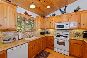 Fridge, microwave, oven, stovetop - Beary Cozy Cabin By Destination Big Bear: Log Cabin!Hot Tub! Wood Flooring! Foosball! Close to the Convention Center! (Big Bear City)