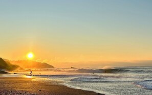 A beach scene with waves and a person walking. - Beautiful bask villa close to Bidart Guethary Biarritz beaches (Ahetze)