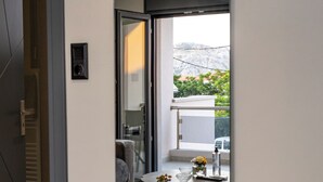 A modern interior with a sliding glass door leading to a balcony.