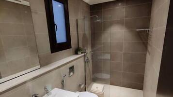 Shower, towels, soap, toilet paper