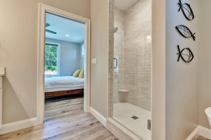 Bathtub, hair dryer, towels, shampoo
