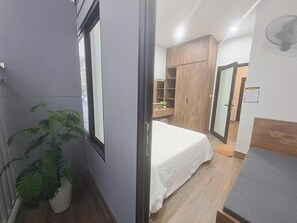 Economy Triple Room | Desk, laptop workspace, blackout drapes, soundproofing - Blue Homestay Cau Giay (Hanoi)