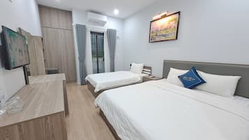 Economy Triple Room | 1 bedroom, desk, laptop workspace, blackout drapes