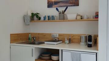 Fridge, microwave, stovetop, coffee/tea maker