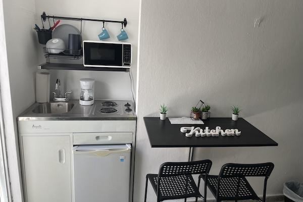 Fridge, microwave, stovetop, coffee/tea maker